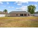 Spacious backyard with room for activities featuring a rear exterior view of the home at 2812 Hickory Ridge Dr, Lakeland, FL 33813
