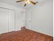 This bedroom has hardwood floors, a closet, and an open doorway for easy access at 2812 Hickory Ridge Dr, Lakeland, FL 33813