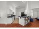Bright kitchen featuring white cabinets, black appliances, a breakfast bar, and modern tile flooring at 2812 Hickory Ridge Dr, Lakeland, FL 33813