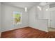 Bright living room with wood floors, neutral walls, and natural light through large windows at 2812 Hickory Ridge Dr, Lakeland, FL 33813