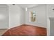 Bright living room with wood floors, neutral walls, and natural light through large windows at 2812 Hickory Ridge Dr, Lakeland, FL 33813