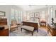 Bright bedroom with shuttered windows, a ceiling fan and classic wooden furniture at 2965 Mission Lakes Dr, Lakeland, FL 33803