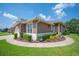 Exterior view of a home with a nicely landscaped yard and attractive curb appeal at 2965 Mission Lakes Dr, Lakeland, FL 33803