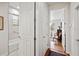 Hallway with bathroom access to a bathtub-shower combination and bedroom access at 2965 Mission Lakes Dr, Lakeland, FL 33803