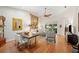 Open concept living and dining area with wood floors and lots of natural light at 2965 Mission Lakes Dr, Lakeland, FL 33803