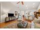 Cozy living room with hardwood floors, comfortable seating, and stylish decor at 2965 Mission Lakes Dr, Lakeland, FL 33803
