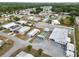 An aerial shot presents community amenities, including shuffleboard courts and a recreation building at 3027 Mimosa Way, Lakeland, FL 33801