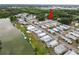 Aerial view showcasing the property's location within a vibrant community near a tranquil lake at 3027 Mimosa Way, Lakeland, FL 33801
