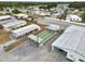 Aerial view highlights shuffleboard courts and the community building with ample parking space at 3027 Mimosa Way, Lakeland, FL 33801