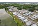 Community aerial view displays waterfront residences and lush greenery in a well-planned layout at 3027 Mimosa Way, Lakeland, FL 33801