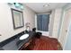 Bathroom with granite countertops, a dark wood vanity, and a shower and tub combination at 3027 Mimosa Way, Lakeland, FL 33801