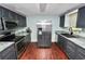 Modern kitchen features stainless steel appliances, granite countertops, and custom cabinets at 3027 Mimosa Way, Lakeland, FL 33801
