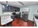 Modern kitchen features stainless steel appliances, granite countertops, and custom cabinets at 3027 Mimosa Way, Lakeland, FL 33801