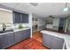 Contemporary kitchen with stainless steel appliances, granite countertops, and adjoining dining area at 3027 Mimosa Way, Lakeland, FL 33801