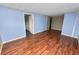 Spacious living room with light blue walls, wood floors and a bright, airy feel at 3027 Mimosa Way, Lakeland, FL 33801