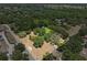 Aerial view of the property showcasing its location and surrounding trees, and road access at 3441 Sherertz Rd, Lakeland, FL 33810