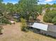 Aerial view of the home, backyard, and surrounding trees at 3441 Sherertz Rd, Lakeland, FL 33810
