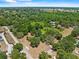 This beautiful aerial view captures the neighborhood's peaceful setting and the home's placement near local roads at 3441 Sherertz Rd, Lakeland, FL 33810