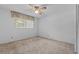 Bright bedroom offering neutral carpet, natural light, and closet space at 3441 Sherertz Rd, Lakeland, FL 33810