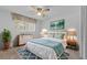Stylishly decorated bedroom showcasing a cozy bed, rug, and decor at 3441 Sherertz Rd, Lakeland, FL 33810