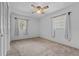 Neutral bedroom featuring a closet and well-lit windows at 3441 Sherertz Rd, Lakeland, FL 33810