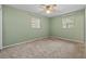 Spacious bedroom featuring a ceiling fan and neutral carpet at 3441 Sherertz Rd, Lakeland, FL 33810