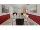 Formal dining area featuring stylish decor, a glass-top table, and comfortable seating for ten at 3441 Sherertz Rd, Lakeland, FL 33810