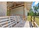 Exterior with wooden awning and a bench swing at 3441 Sherertz Rd, Lakeland, FL 33810