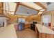 Charming kitchen features wooden cabinets, stainless steel appliances, and unique brick flooring at 3441 Sherertz Rd, Lakeland, FL 33810