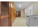 The laundry room includes a washer and dryer along with built in storage at 3441 Sherertz Rd, Lakeland, FL 33810