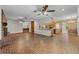 Expansive living room with brick flooring, a fireplace, and an adjacent kitchen area at 3441 Sherertz Rd, Lakeland, FL 33810