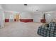 Expansive living room with plush carpet flooring, multiple windows, and recessed lighting fixtures at 3441 Sherertz Rd, Lakeland, FL 33810
