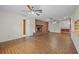 Living room showcasing brick flooring, a brick fireplace, and an open layout at 3441 Sherertz Rd, Lakeland, FL 33810