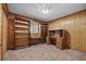 Wood-paneled room featuring a built-in desk and shelves at 3441 Sherertz Rd, Lakeland, FL 33810