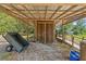 Shed with a wagon and wooden door in an area covered with gravel at 3441 Sherertz Rd, Lakeland, FL 33810