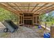 Shed with open wooden door and gravel ground at 3441 Sherertz Rd, Lakeland, FL 33810
