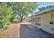 Backyard features a partially-covered patio and grassy area at 346 Tanager Ct, Lakeland, FL 33803