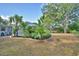 The backyard features a pool, lush landscaping, and well-maintained lawn. Perfect for relaxing at 346 Tanager Ct, Lakeland, FL 33803