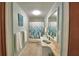 Well-maintained bathroom featuring a tub with curtain, tiled floor, vanity, and a mirror at 346 Tanager Ct, Lakeland, FL 33803