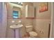 Bathroom showcasing tile, a pedestal sink, and a classic vanity at 346 Tanager Ct, Lakeland, FL 33803