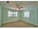 Bright bedroom with carpet flooring, and sun-filled windows at 346 Tanager Ct, Lakeland, FL 33803