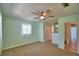 Comfortable bedroom with carpet, a ceiling fan, a window, and closet, offering ample storage at 346 Tanager Ct, Lakeland, FL 33803