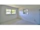 Neutral bedroom featuring two windows letting in lots of natural light and white walls at 346 Tanager Ct, Lakeland, FL 33803