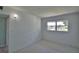 Neutral bedroom featuring a window letting in lots of natural light and white walls at 346 Tanager Ct, Lakeland, FL 33803