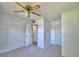 Carpeted bedroom featuring multiple closets, a ceiling fan, and neutral tones at 346 Tanager Ct, Lakeland, FL 33803