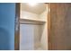 Empty closet with white walls and a shelf, providing storage space at 346 Tanager Ct, Lakeland, FL 33803