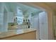 Well-lit kitchen with ample cabinet space and a breakfast bar overlooking the dining room at 346 Tanager Ct, Lakeland, FL 33803