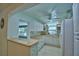 Kitchen with breakfast bar open to another living area at 346 Tanager Ct, Lakeland, FL 33803