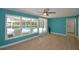 Bright and airy living room with large windows overlooking the pool area at 346 Tanager Ct, Lakeland, FL 33803