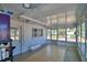 Enclosed patio shows tile flooring and multiple windows that provides natural light and outdoor views at 346 Tanager Ct, Lakeland, FL 33803